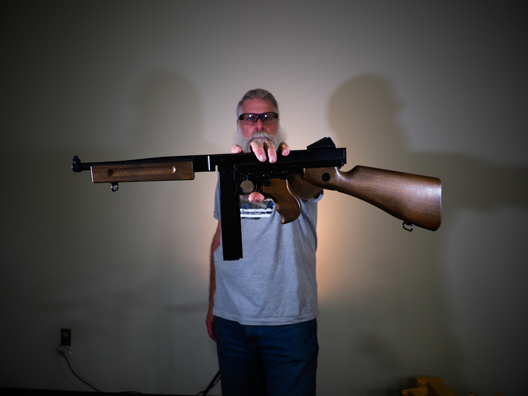 Legends M1A1 BB gun being held at arm's length